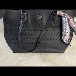 Gently used shoulder bag with cute design along front and back.